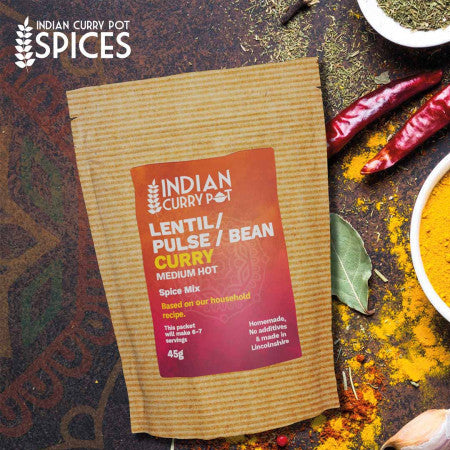 Spice mix package with ingredients on a rustic background