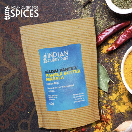 Spice mix package with ingredients on a rustic background, featuring 'Indian Curry Pot' branding.